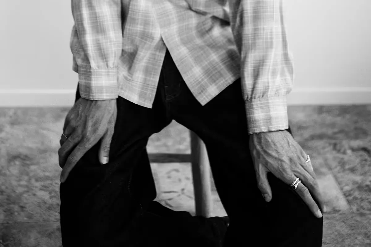 Close-up of hands in plaid shirt cuffs