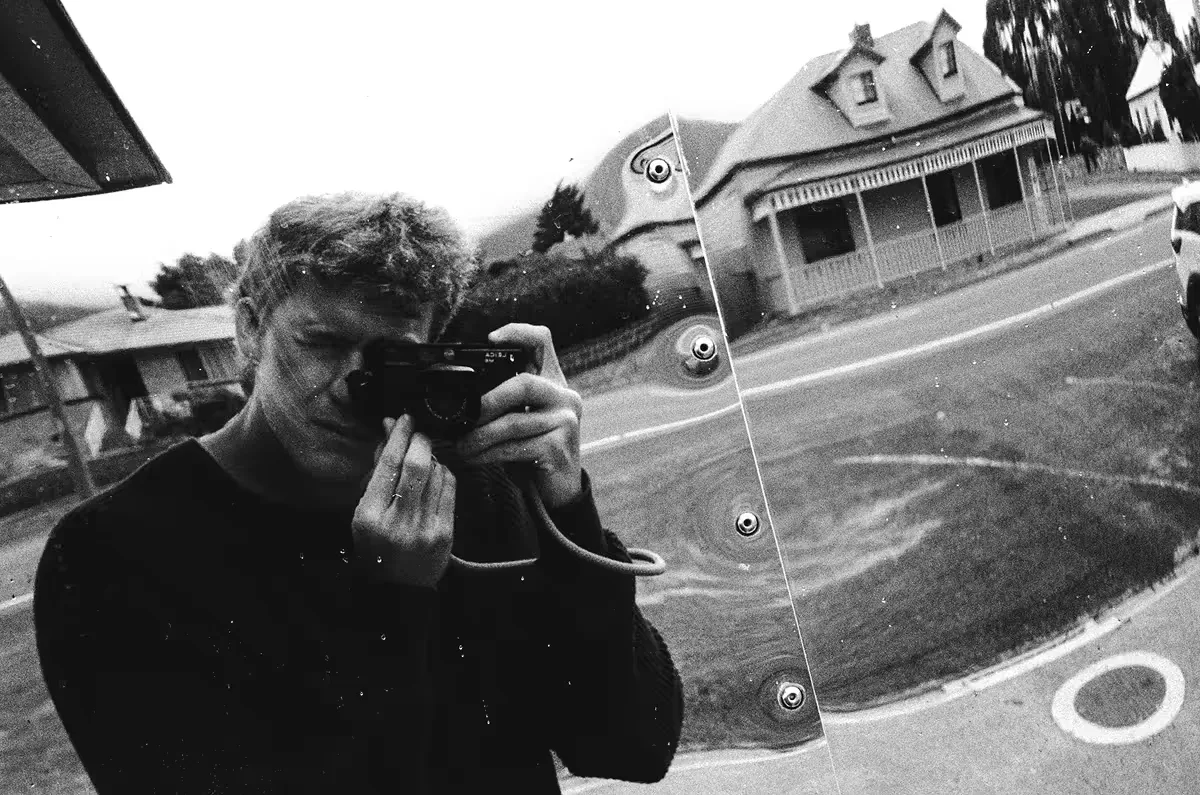 Kitale Wilson taking a picture of himself through a reflection
